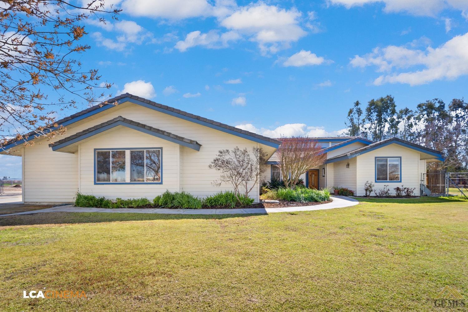 Undisclosed Address Bakersfield, CA 93314 - Photo 4 of 33 a front view of house with yard and green space