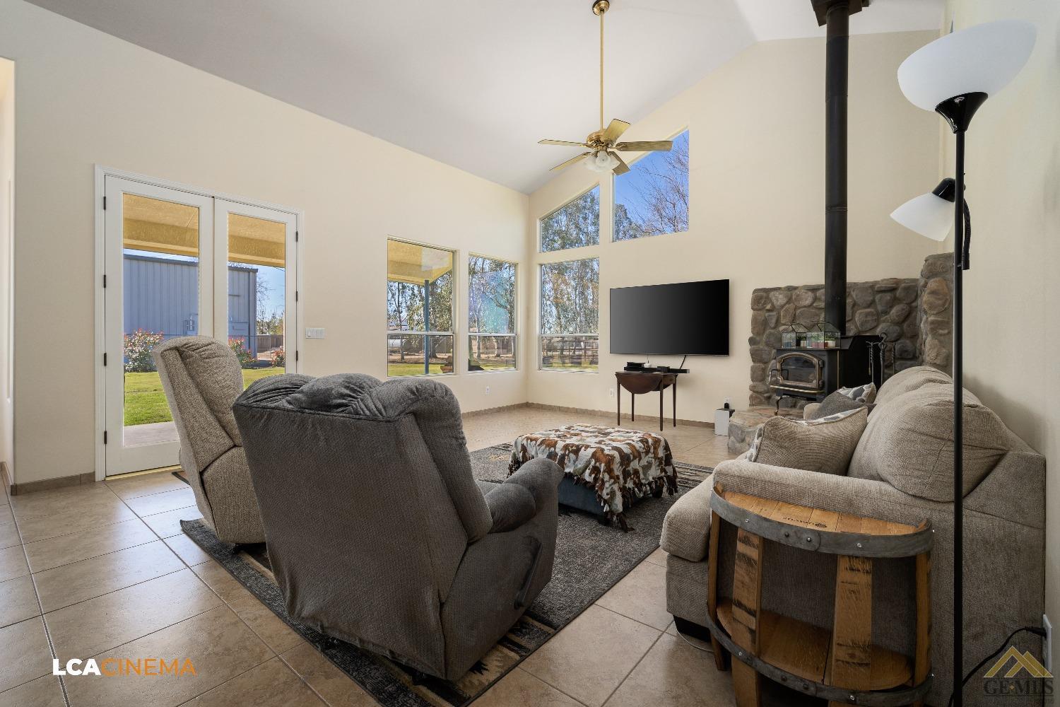 Undisclosed Address Bakersfield, CA 93314 - Photo 10 of 33 a living room with furniture and a flat screen tv