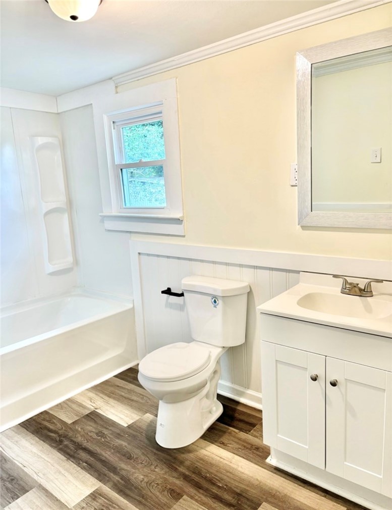 208 Hampton Street Iva, SC 29655 - Photo 15 of 19 This bright bathroom features durable flooring and essential fixtures for comfortable living.