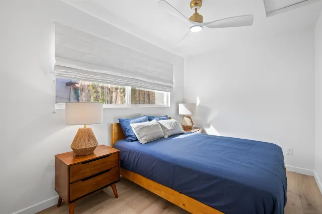 a bedroom with a bed and window