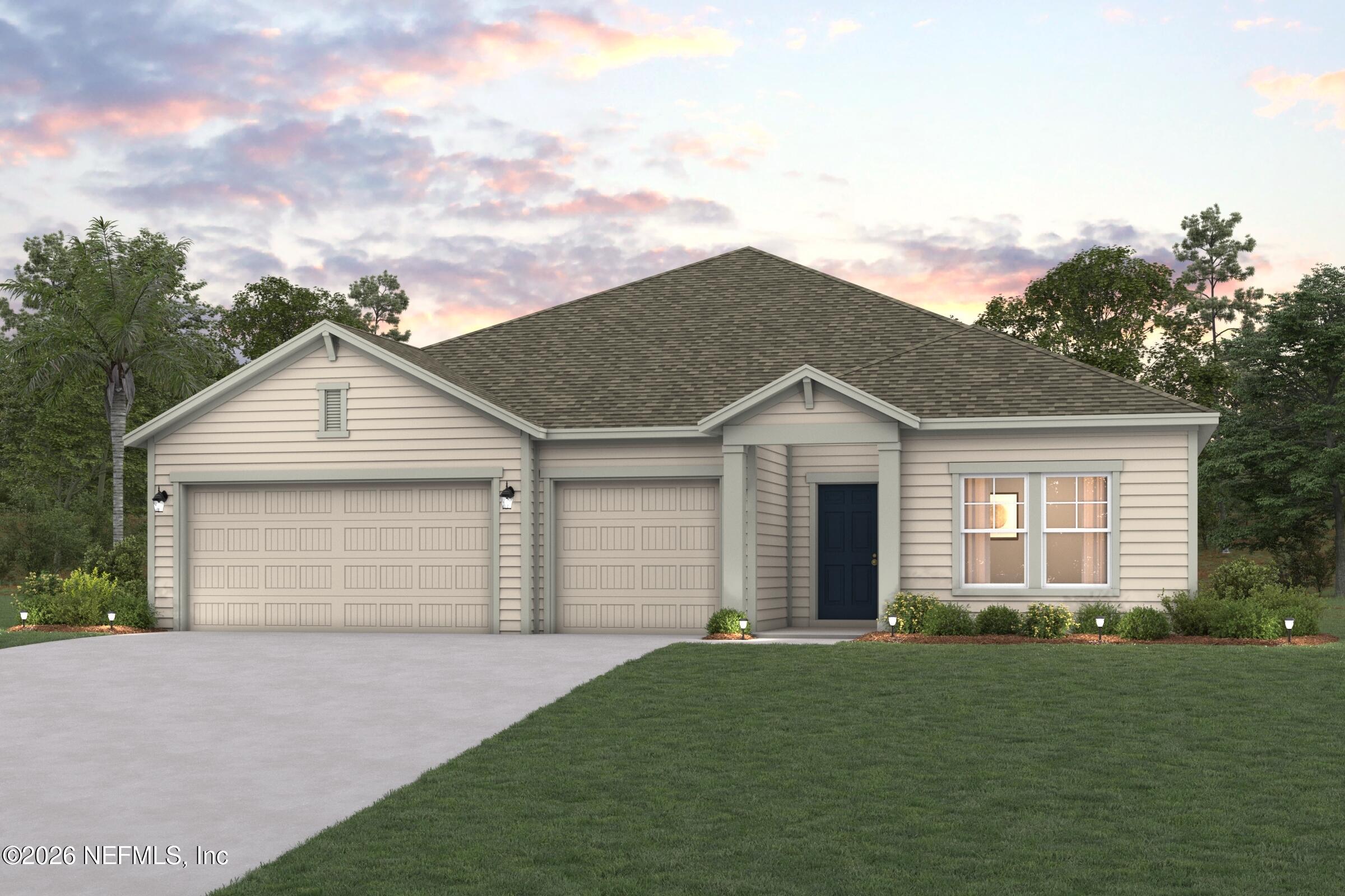 52 Pegasus Road Flagler Beach, FL 32136 - Photo 4 of 6 a front view of a house with a yard and garage