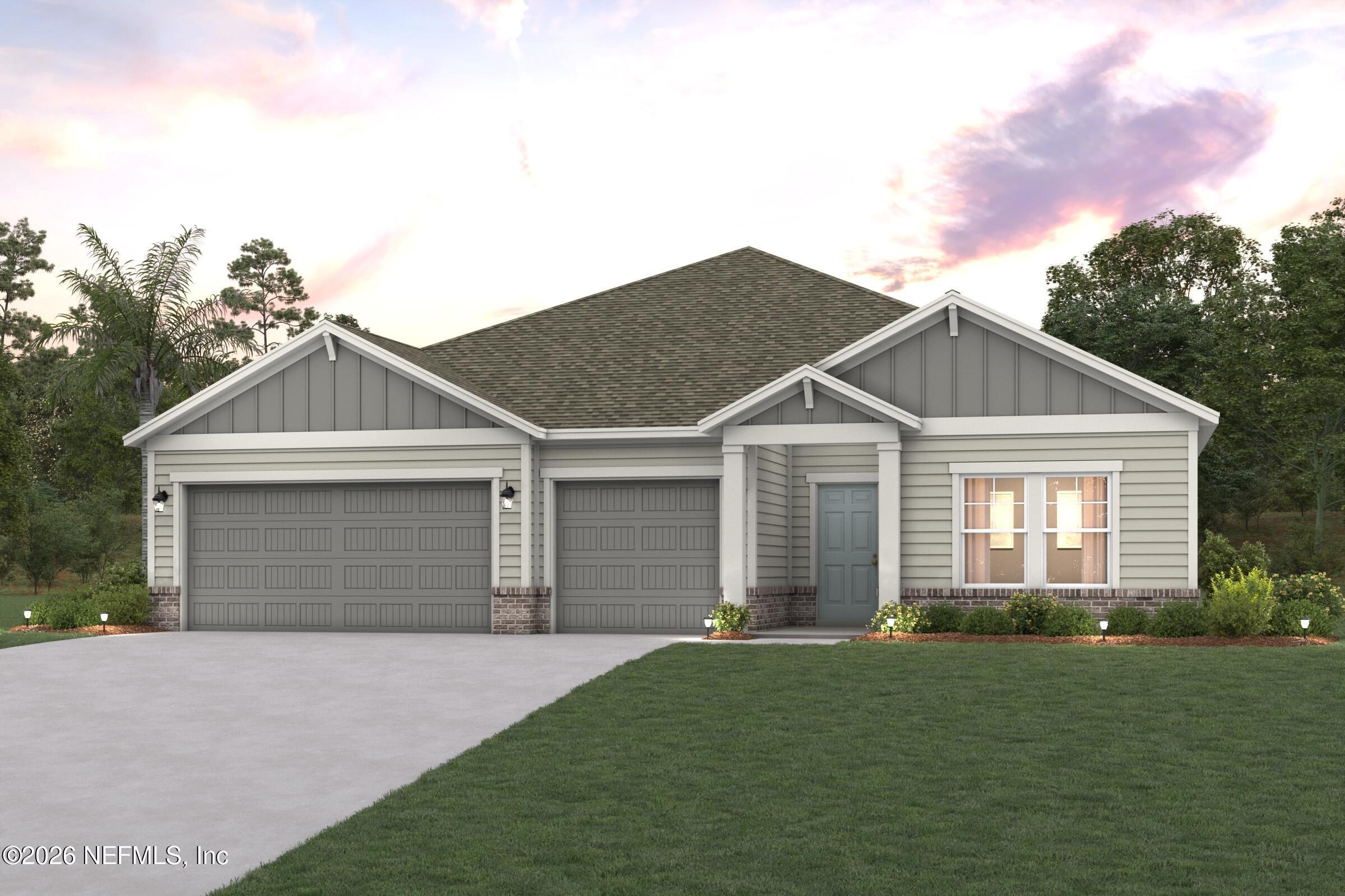 52 Pegasus Road Flagler Beach, FL 32136 - Photo 5 of 6 a front view of a house with a yard and garage