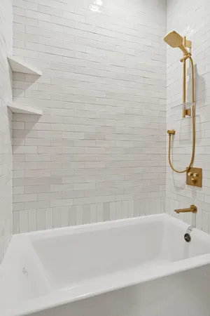 a bathroom with a bath tub