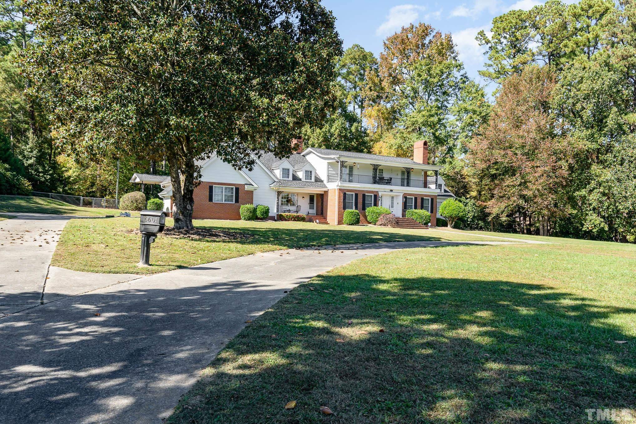 5601 Castlebrook Drive Raleigh, NC 27604 - Photo 1 of 34 a front view of a house with a yard