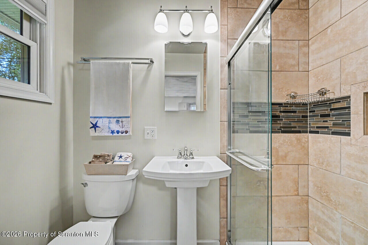 121 T Rt 351 Moscow, PA 18444 - Photo 46 of 79 a bathroom with a sink a toilet and mirror