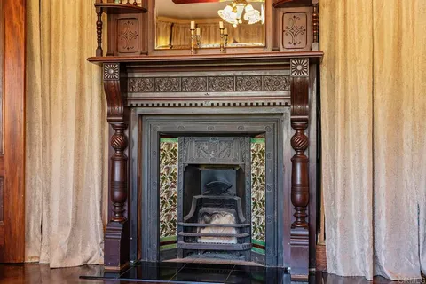 a kitchen with stainless steel appliances granite countertop a stove a sink dishwasher and cabinets with wooden floor