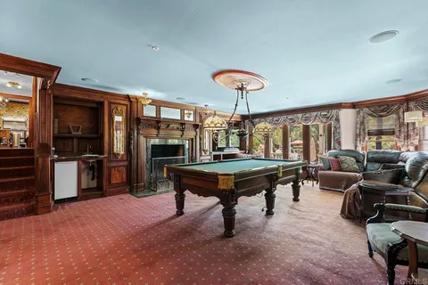 a view of a dining room with furniture wooden floor and chandelier