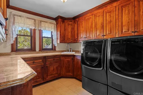 a view of staircase with wooden floor and a large window