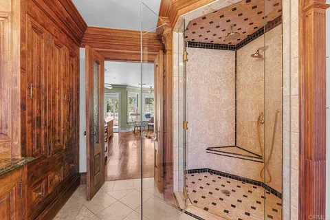 a view of backyard with seating space and trees