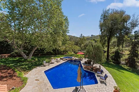 a view of swimming pool with outdoor seating