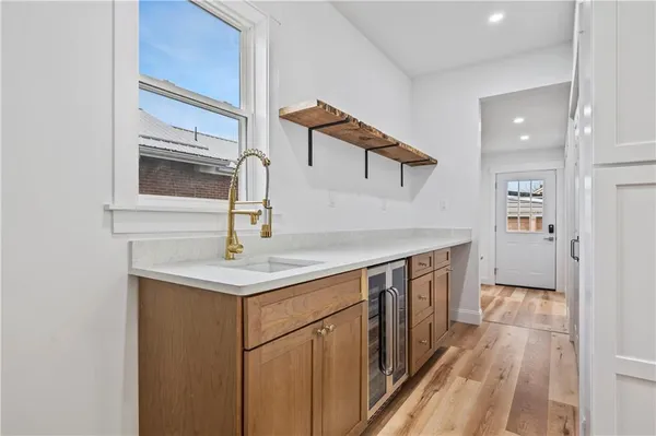 a kitchen with a sink and a refrigerator