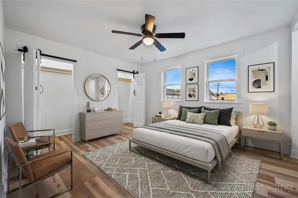 a bedroom with a bed and a dresser