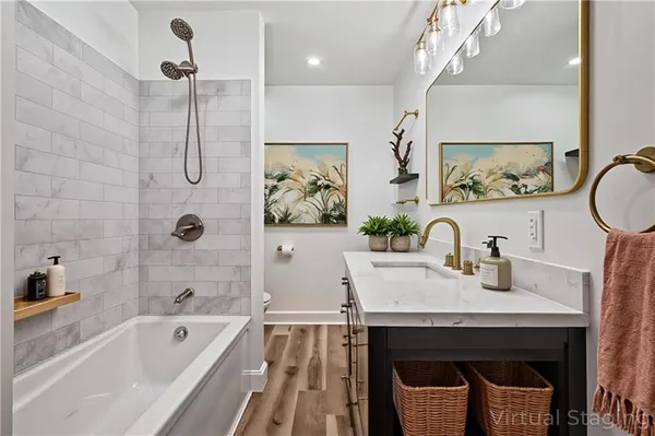 a bath room with a bathtub and a sink