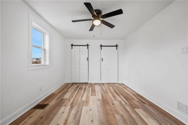 a view of room with a ceiling fan