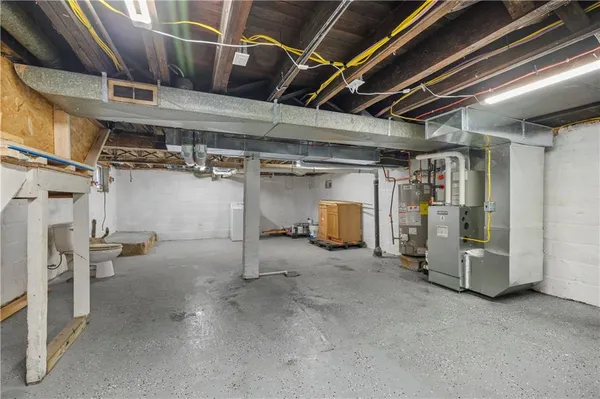 a view of empty room with wooden ceiling