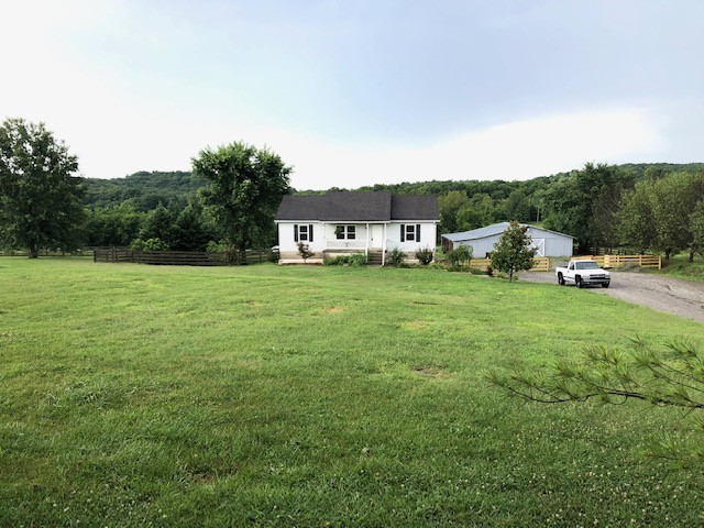 869 Chicken Road Lebanon, TN 37090 - Photo 1 of 8 a view of a green field with lots of trees in it