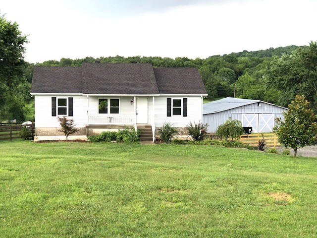 869 Chicken Road Lebanon, TN 37090 - Photo 2 of 8 a front view of house with yard and green space