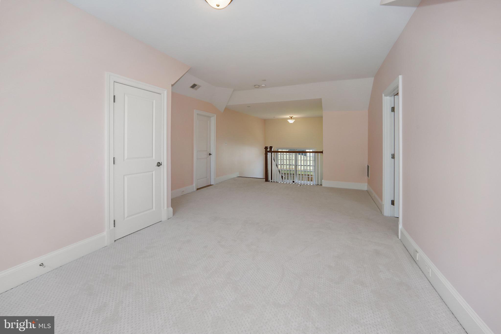 7117 Exfair Road Bethesda, MD 20814 - Photo 30 of 42 a view of a livingroom with furniture and a refrigerator