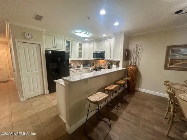 a bedroom with a bed and a lamp