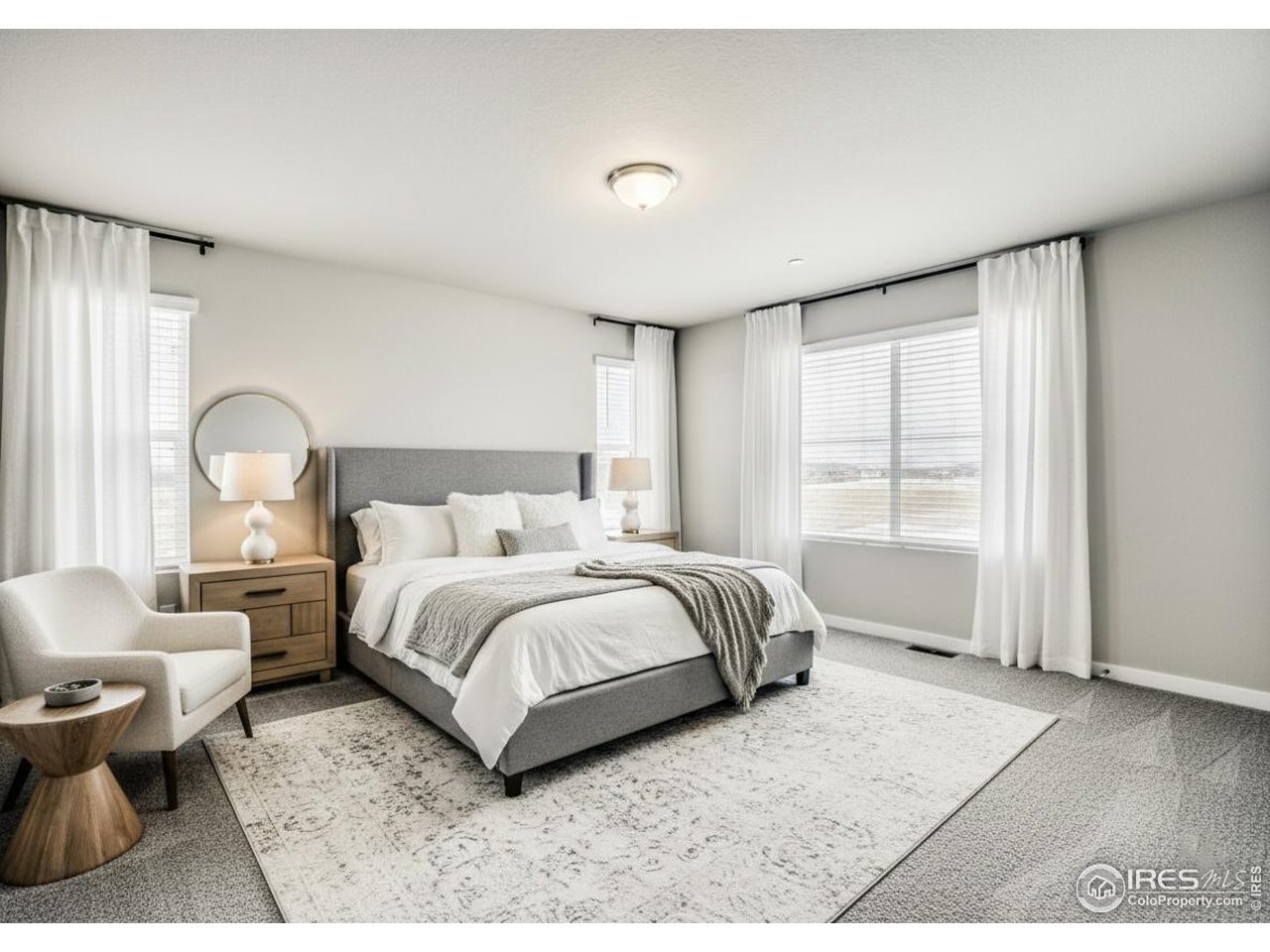 2367 East Suniga Road Fort Collins, CO 80524 - Photo 11 of 26 a bed room with a bed and a large window