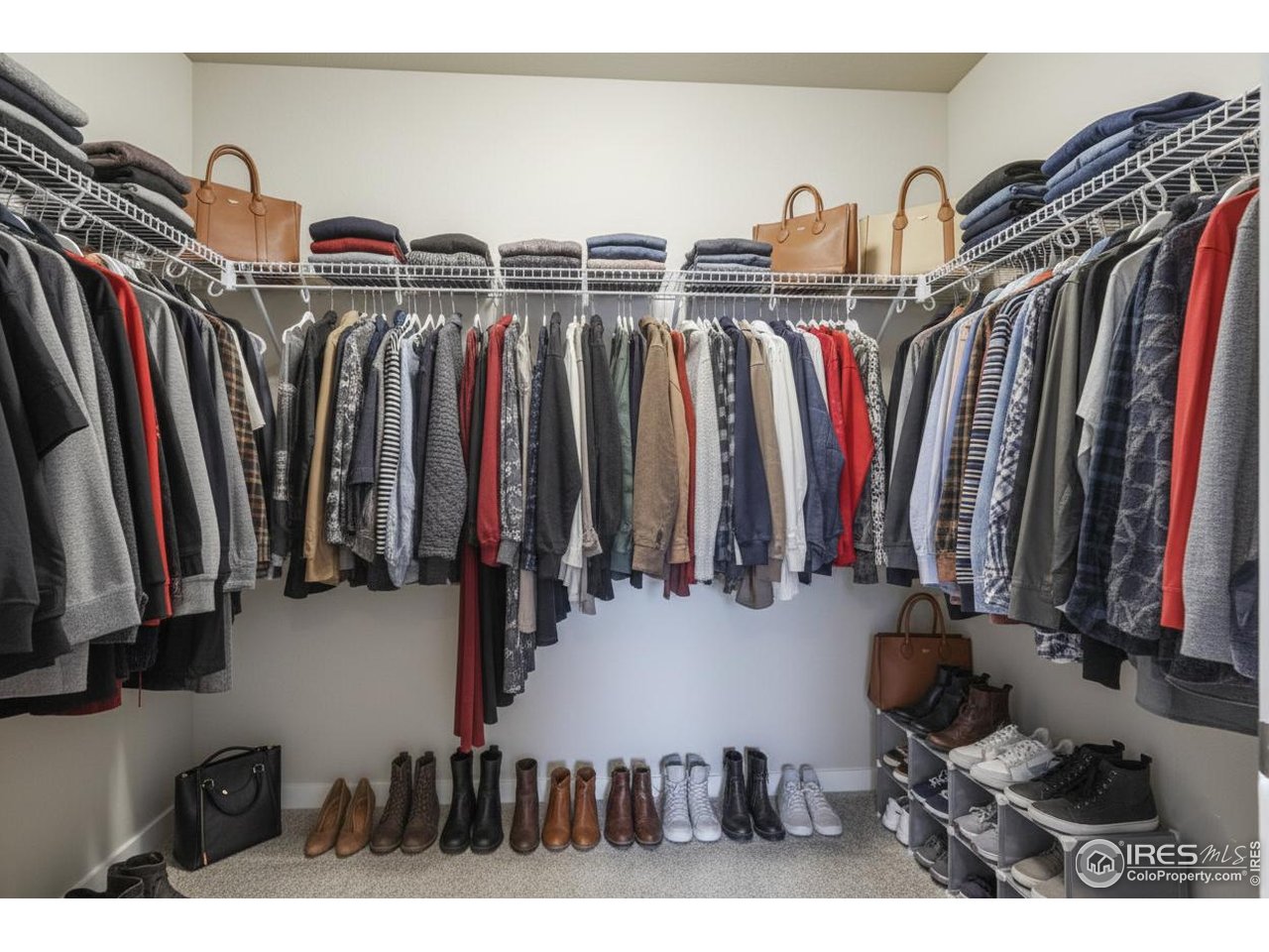 2367 East Suniga Road Fort Collins, CO 80524 - Photo 17 of 26 a view of walk in closet with clothes and shoes