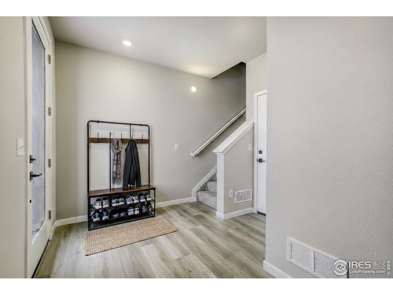 2367 East Suniga Road Fort Collins, CO 80524 - Photo 4 of 26 a view of entryway with wooden floor