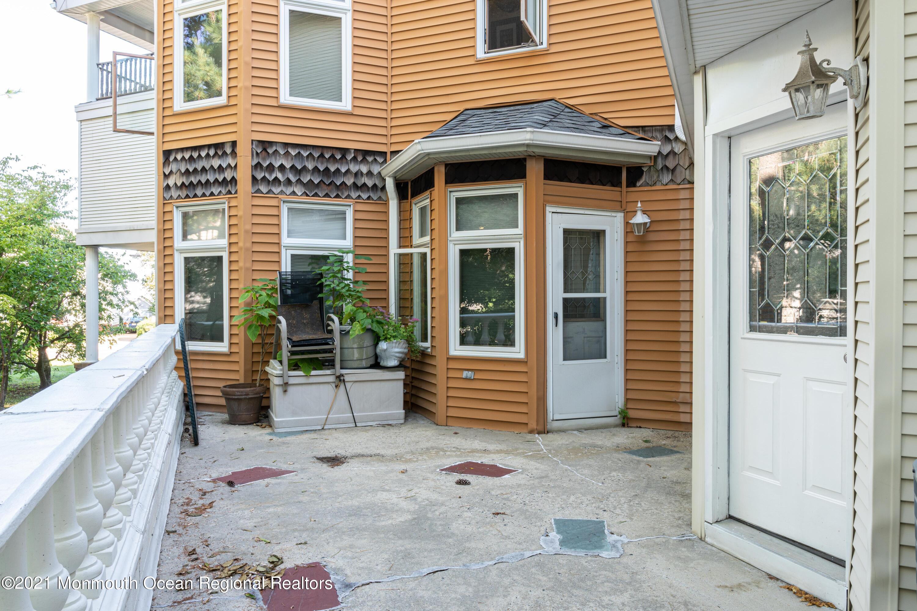 100 1st Street, Unit 5 Keyport, NJ 07735 - Photo 14 of 18 a front view of a house with a yard