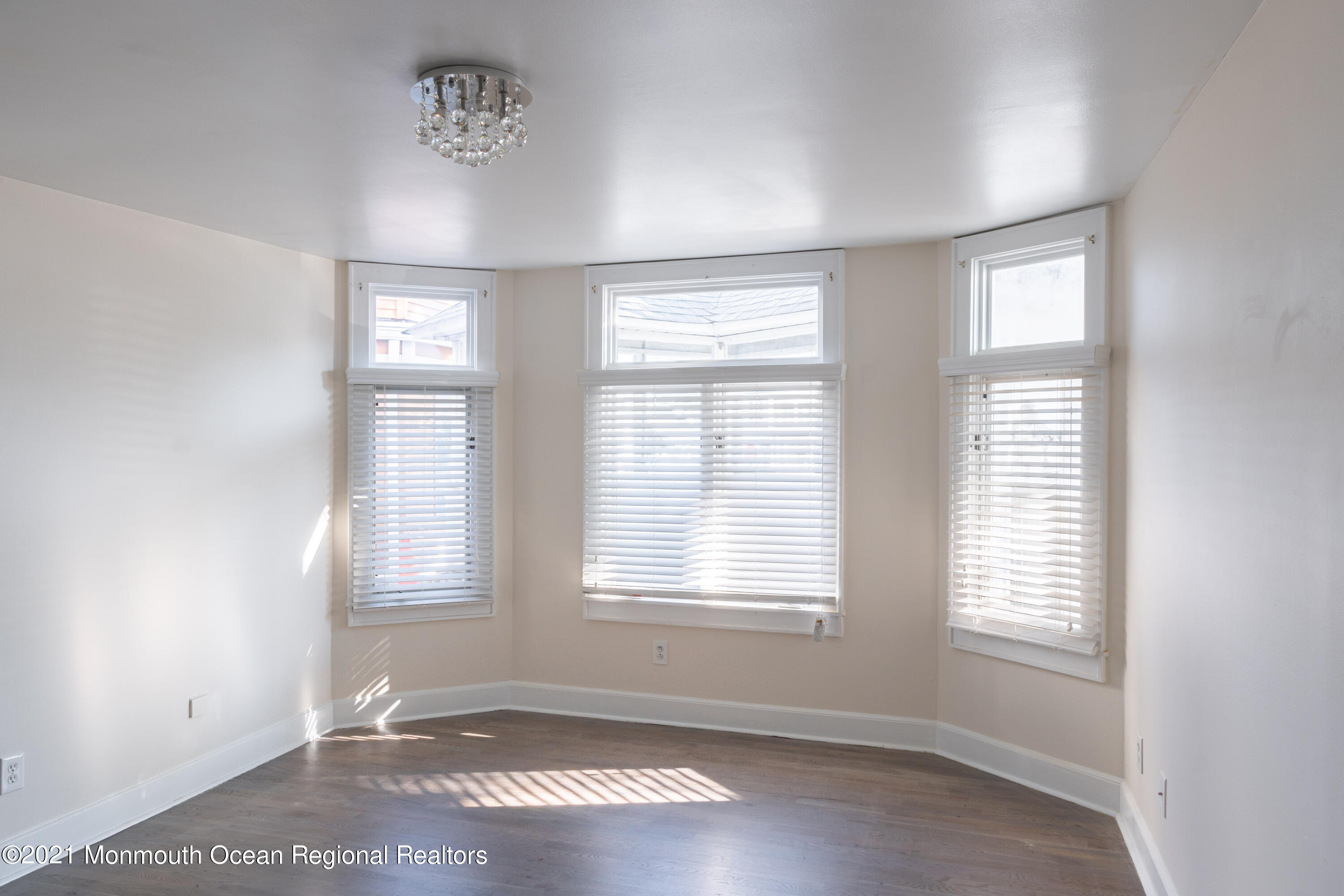 100 1st Street, Unit 5 Keyport, NJ 07735 - Photo 4 of 18 an empty room with windows