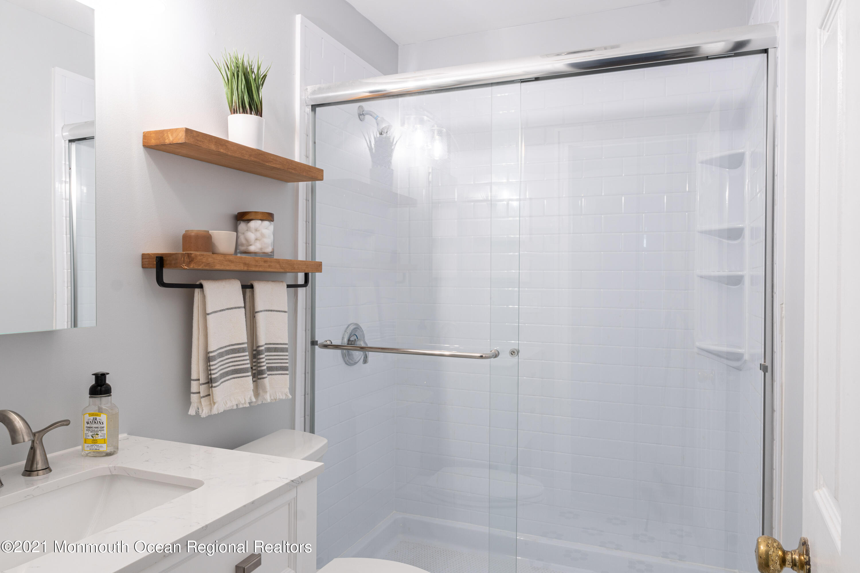 100 1st Street, Unit 5 Keyport, NJ 07735 - Photo 7 of 18 a bathroom with a sink and a mirror