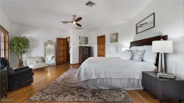 a large bathroom with a double vanity sink a mirror and a shower