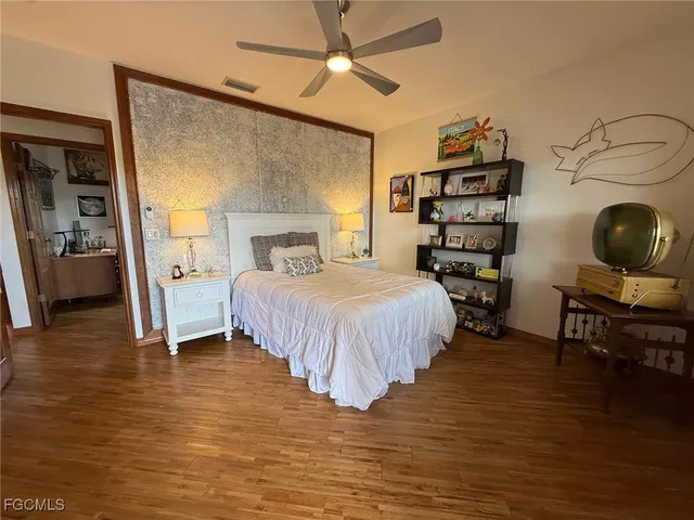 a view of a balcony with furniture and wooden floor