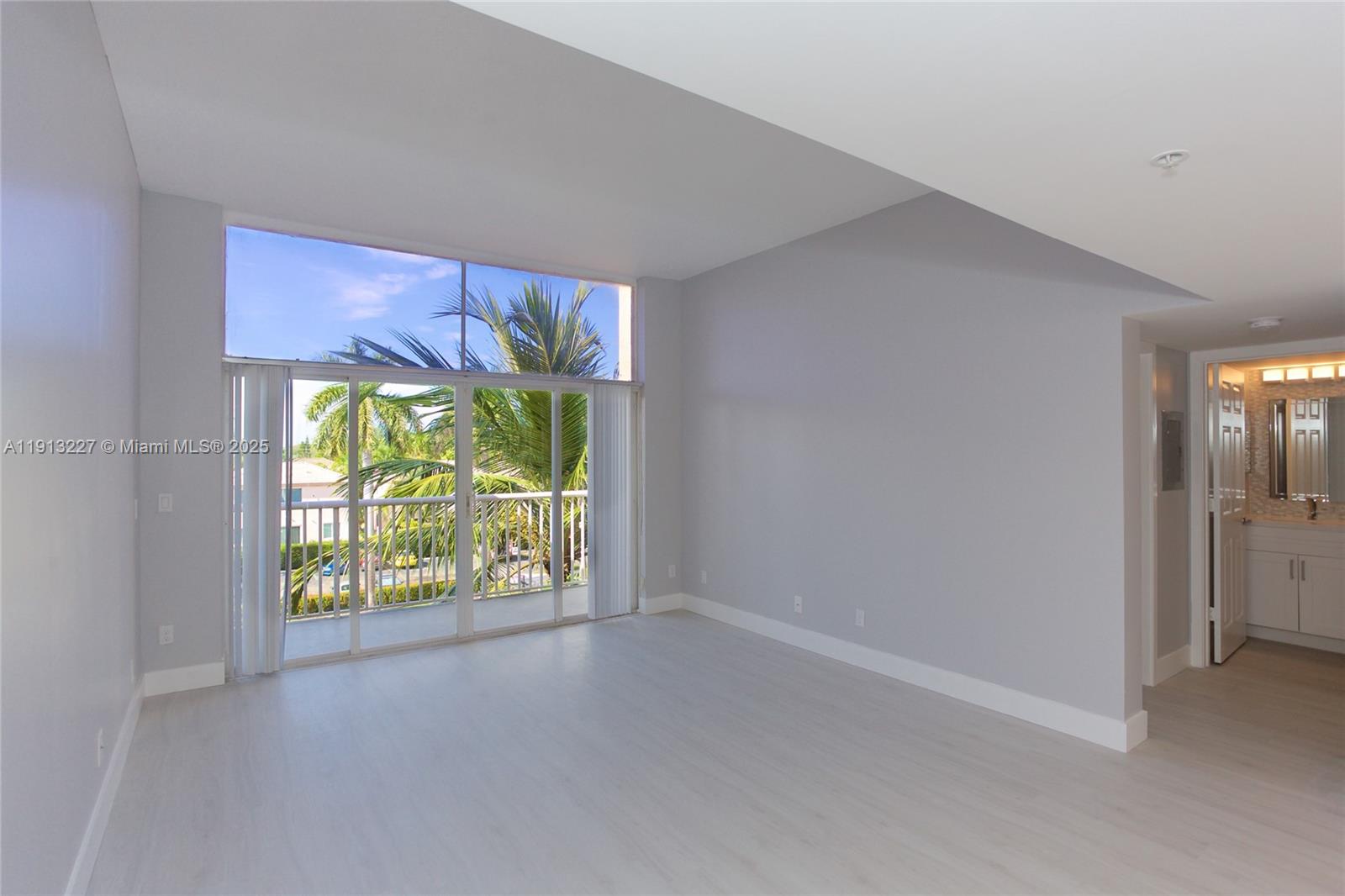 1350 Southeast 3rd Avenue, Unit 404 Dania Beach, FL 33004 - Photo 1 of 26 a view of an empty room with a window