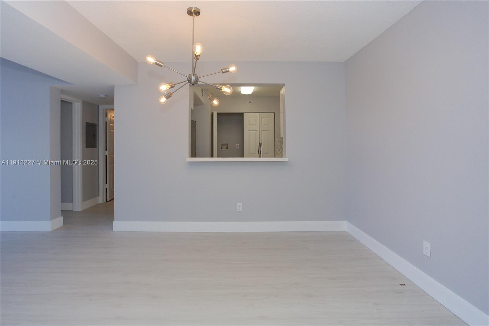 1350 Southeast 3rd Avenue, Unit 404 Dania Beach, FL 33004 - Photo 11 of 26 a view of an empty room with a window