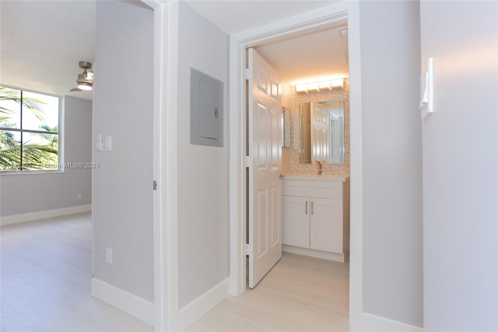 1350 Southeast 3rd Avenue, Unit 404 Dania Beach, FL 33004 - Photo 12 of 26 an empty room with windows and closet