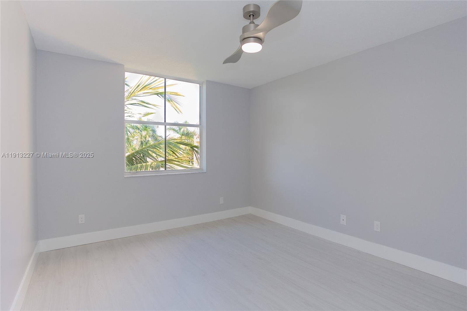 1350 Southeast 3rd Avenue, Unit 404 Dania Beach, FL 33004 - Photo 15 of 26 an empty room with windows