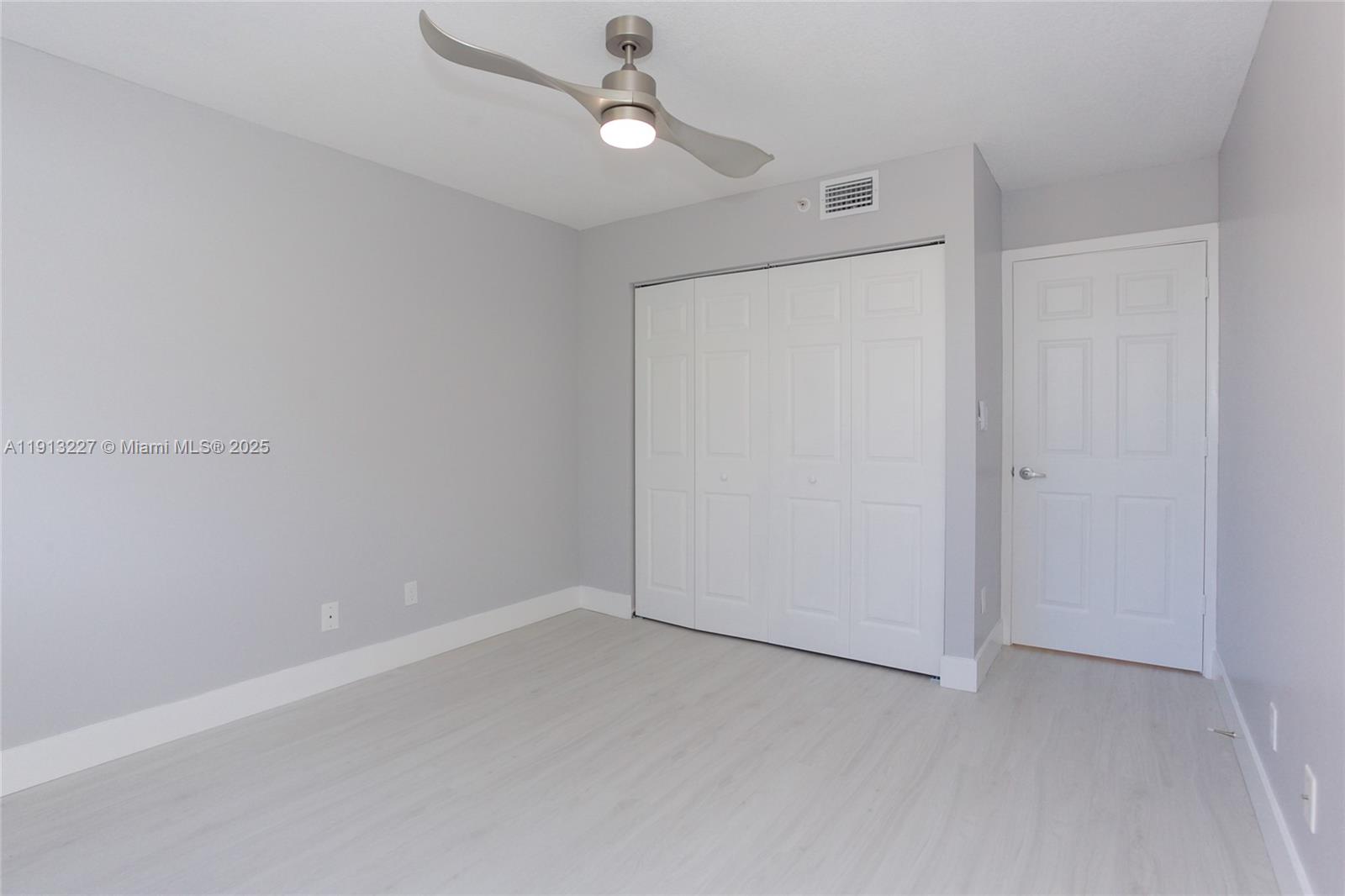 1350 Southeast 3rd Avenue, Unit 404 Dania Beach, FL 33004 - Photo 16 of 26 wooden floor in an empty room