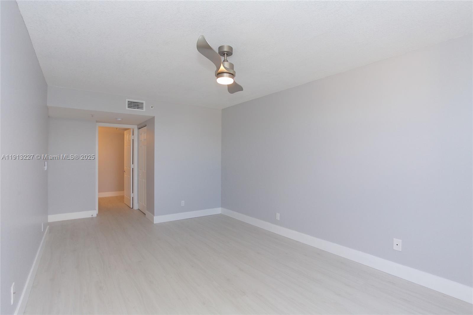 1350 Southeast 3rd Avenue, Unit 404 Dania Beach, FL 33004 - Photo 19 of 26 a view of an empty room with a window