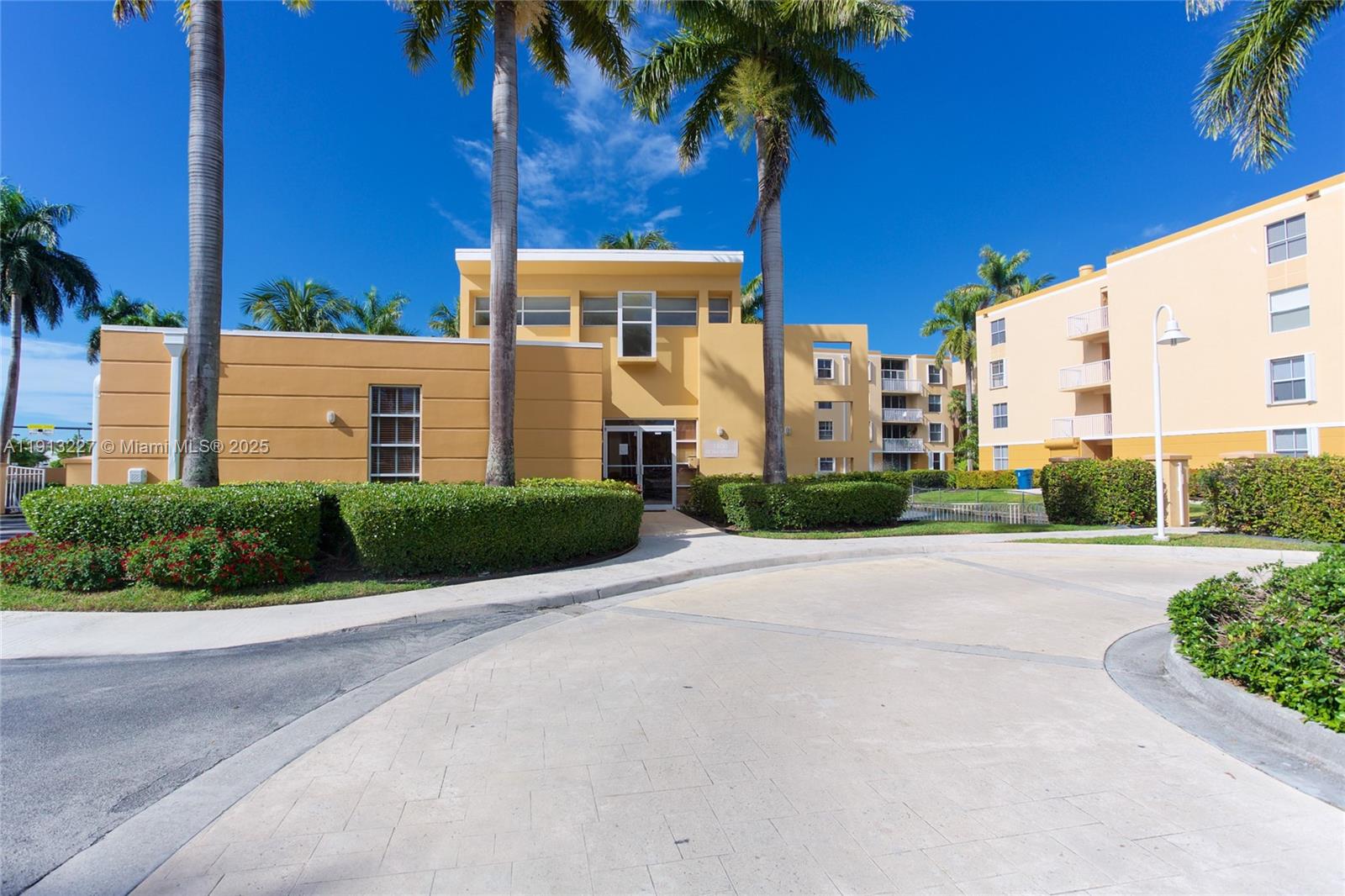 1350 Southeast 3rd Avenue, Unit 404 Dania Beach, FL 33004 - Photo 24 of 26 a view of a palm trees in front of a building