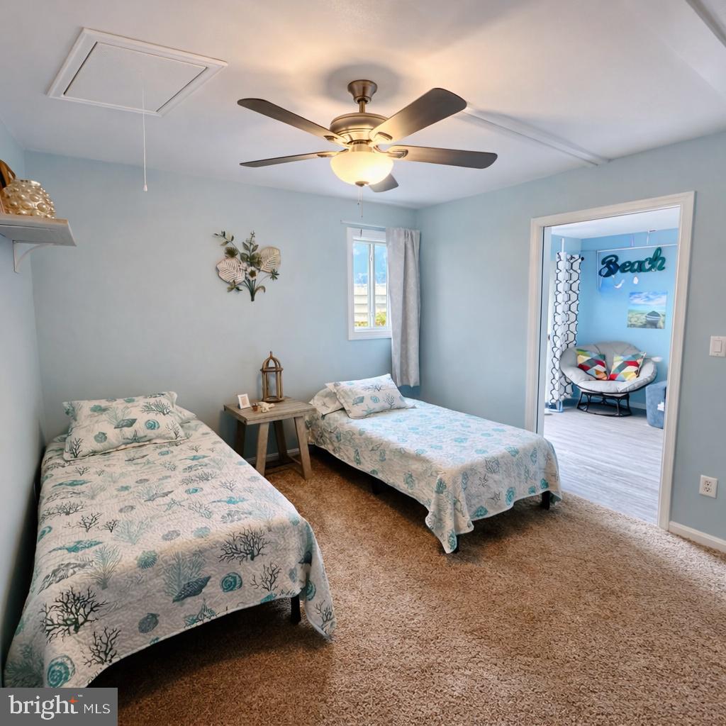 105 120th Street, Unit 37 Ocean City, MD 21842 - Photo 13 of 26 a bedroom with a bed and window