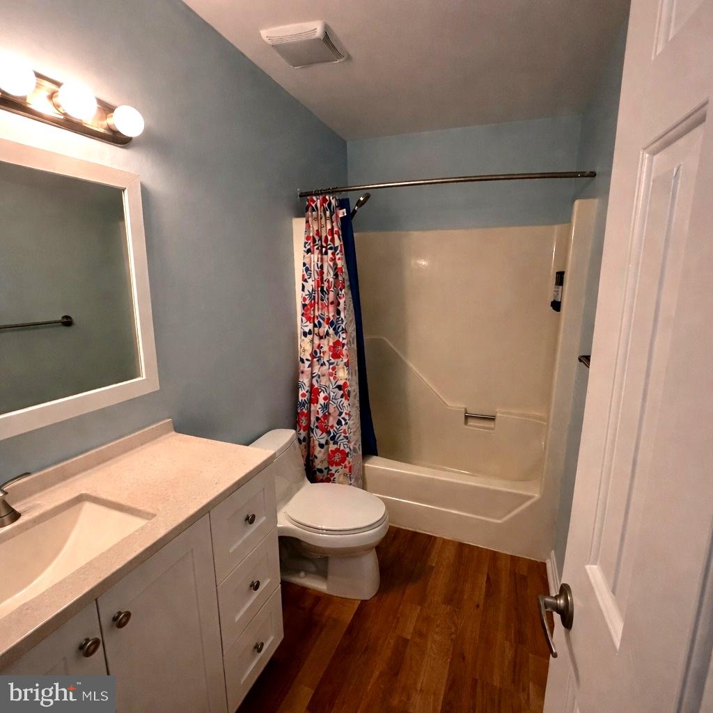 105 120th Street, Unit 37 Ocean City, MD 21842 - Photo 14 of 26 a bathroom with a sink a toilet and shower