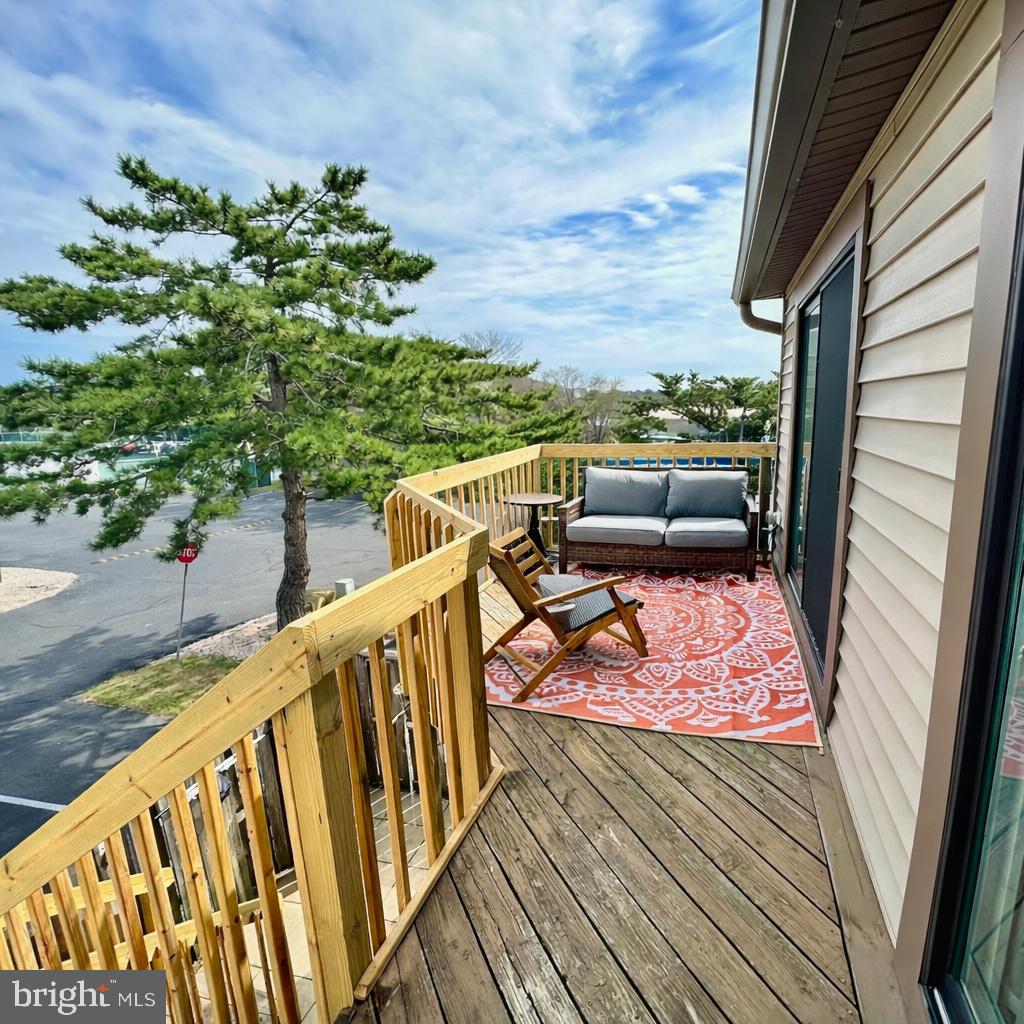 105 120th Street, Unit 37 Ocean City, MD 21842 - Photo 2 of 26 a view of a balcony with furniture