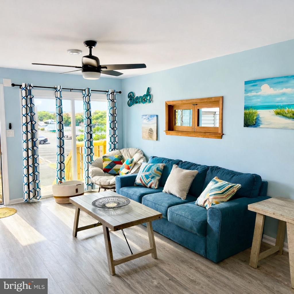 105 120th Street, Unit 37 Ocean City, MD 21842 - Photo 4 of 26 a living room with furniture and a large window
