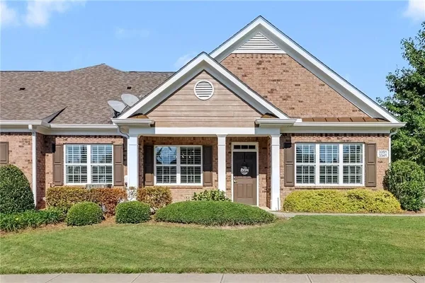 front view of a house with a yard