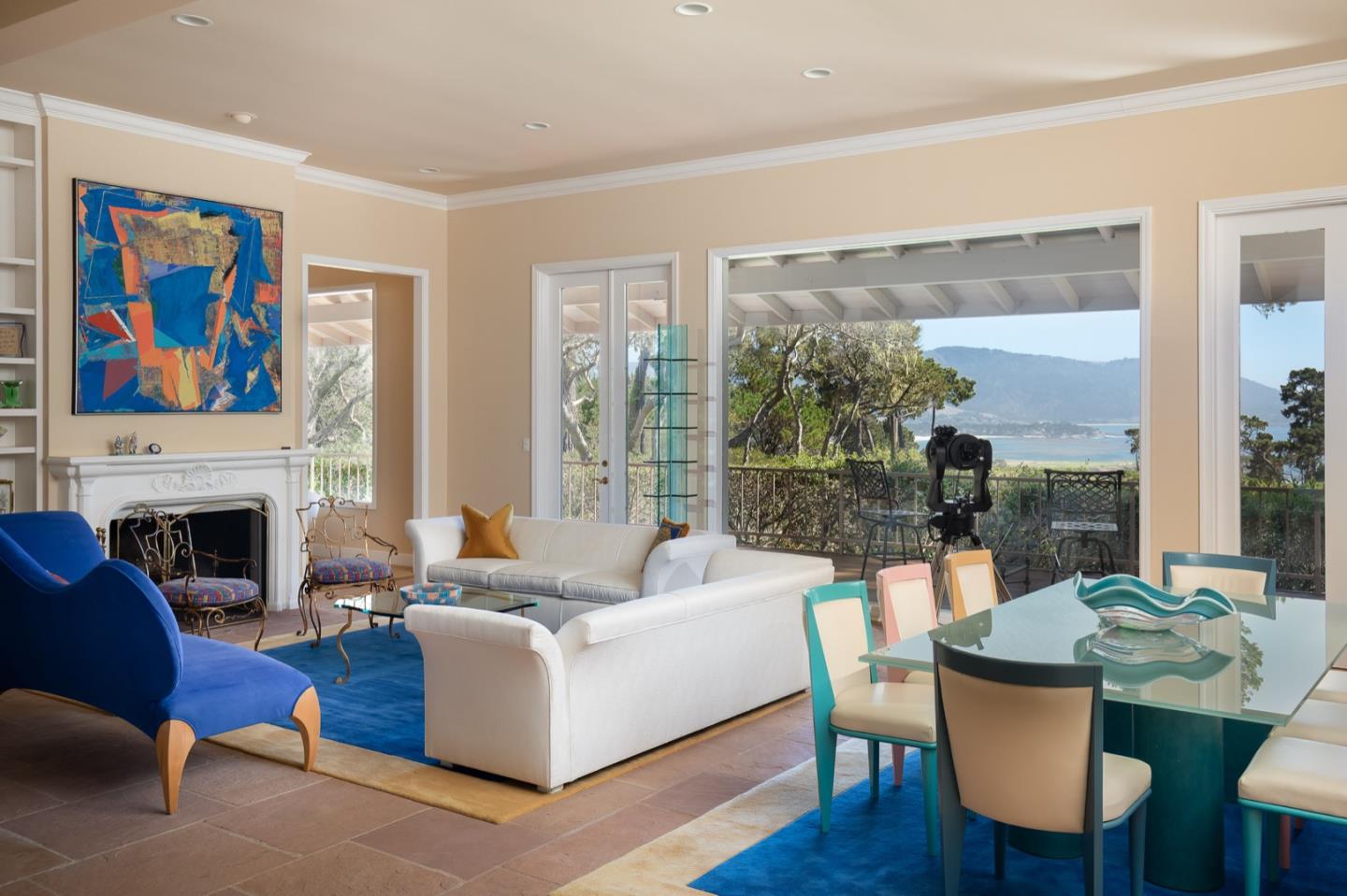 1477 Bonifacio Road Pebble Beach, CA 93953 - Photo 3 of 27 a living room with furniture a fireplace and a large window