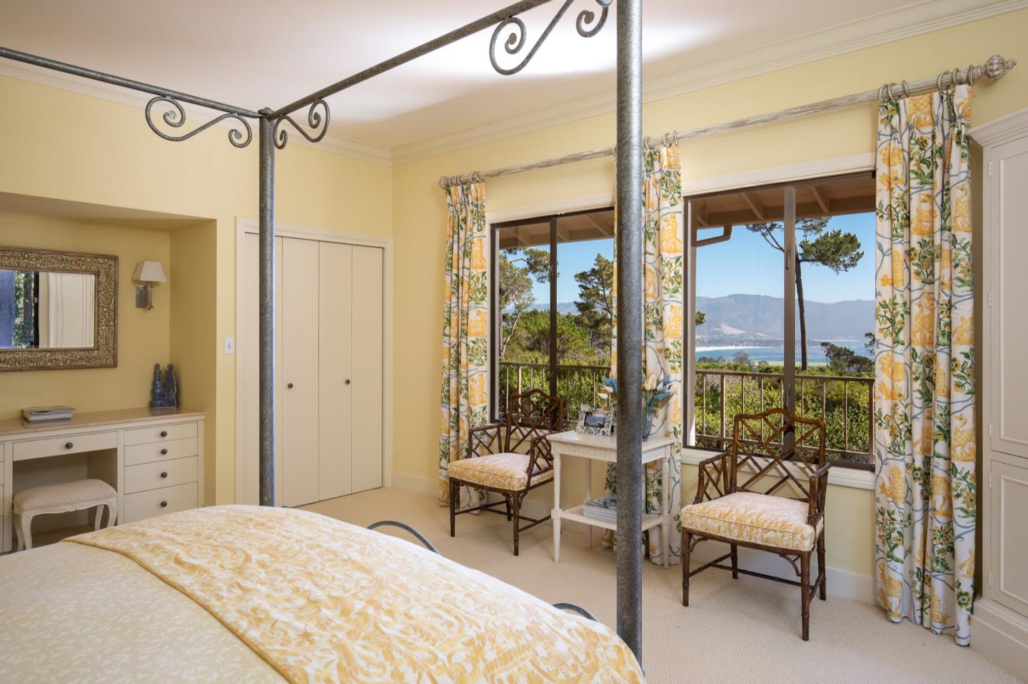 1477 Bonifacio Road Pebble Beach, CA 93953 - Photo 6 of 27 a bedroom with a bed and a balcony view
