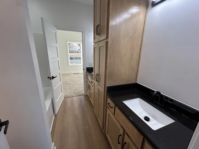 a bathroom with a tub and a sink