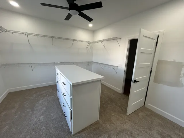 a utility room with cabinets washer and dryer