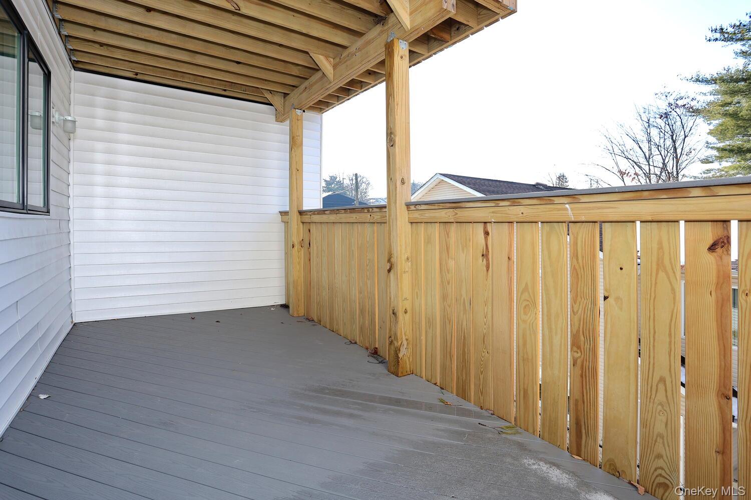 4 Howard Drive, Unit 213 Spring Valley, NY 10977 - Photo 15 of 42 a view of a wooden balcony