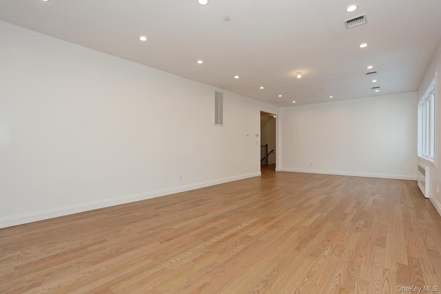 4 Howard Drive, Unit 213 Spring Valley, NY 10977 - Photo 20 of 42 a view of an empty room with wooden floor