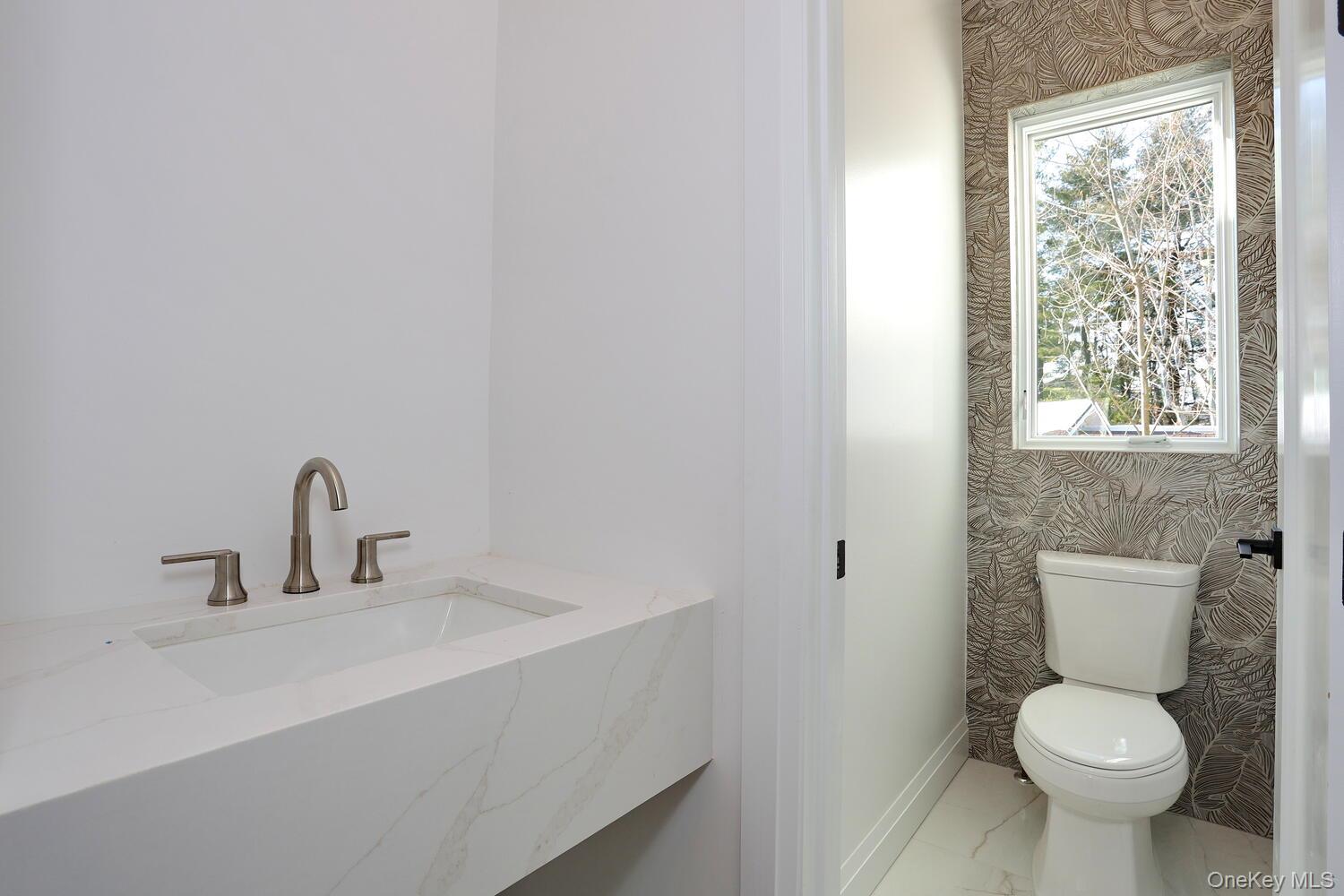 4 Howard Drive, Unit 213 Spring Valley, NY 10977 - Photo 21 of 42 a bathroom with a sink toilet and a window